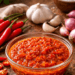 Sajian saus sambal viral yang merah merona dan menggugah selera sebagai teman makan camilan.