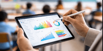 Proses evaluasi hasil TKA oleh tenaga pendidik menggunakan perangkat digital untuk memantau grafik perkembangan siswa.