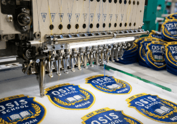 Hasil bordir atribut OSIS yang rapi dan presisi dari penyedia jasa bordir logo sekolah Medan.