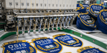 Hasil bordir atribut OSIS yang rapi dan presisi dari penyedia jasa bordir logo sekolah Medan.