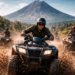 Keseruan wisatawan saat bermain ATV Berastagi menaklukkan jalur berlumpur dengan latar belakang pegunungan.