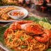 Sajian Kuliner Malam Mie Aceh dengan topping kepiting segar yang menjadi favorit para pelancong di Medan.