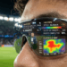 Tampilan antarmuka digital pada lensa dalam review kacamata pintar AI yang menyajikan statistik pemain sepak bola secara langsung.