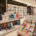 Jajaran tempat buku materi TKP CPNS terbaik bahan premium untuk usaha persiapan ujian aparatur sipil negara dan alat modul kepribadian ASN heavy duty minimalis berbagai panduan analisis studi kasus yang tersusun sangat rapi di dalam etalase toko perlengkapan kantor