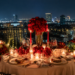 Keindahan tatanan meja makan malam romantis dengan lilin menyala dan latar belakang kerlip lampu kota di salah satu tempat dinner romantis di Medan